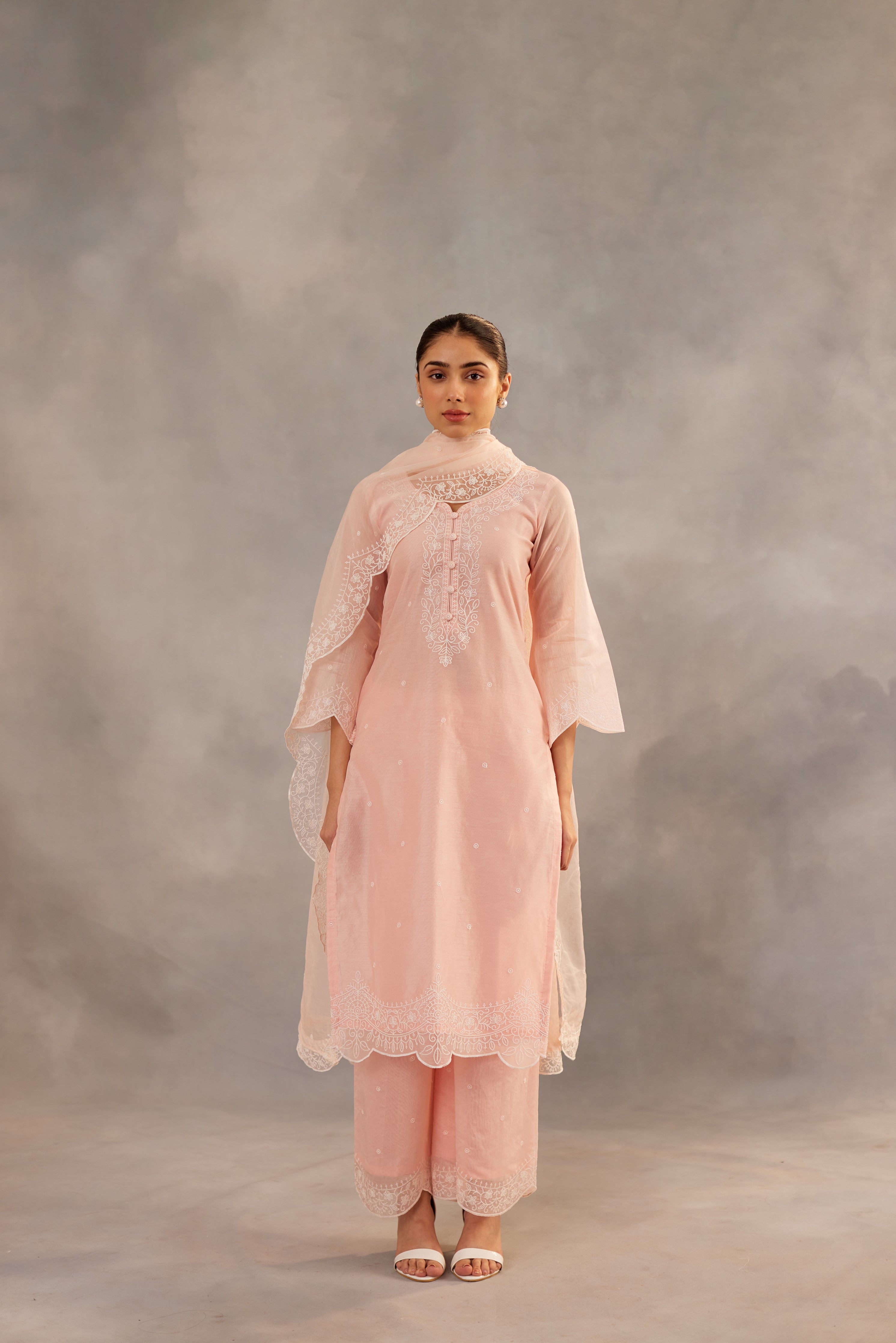 Diksha Juneja in Kamal - Peach Embroidered Suit Set.