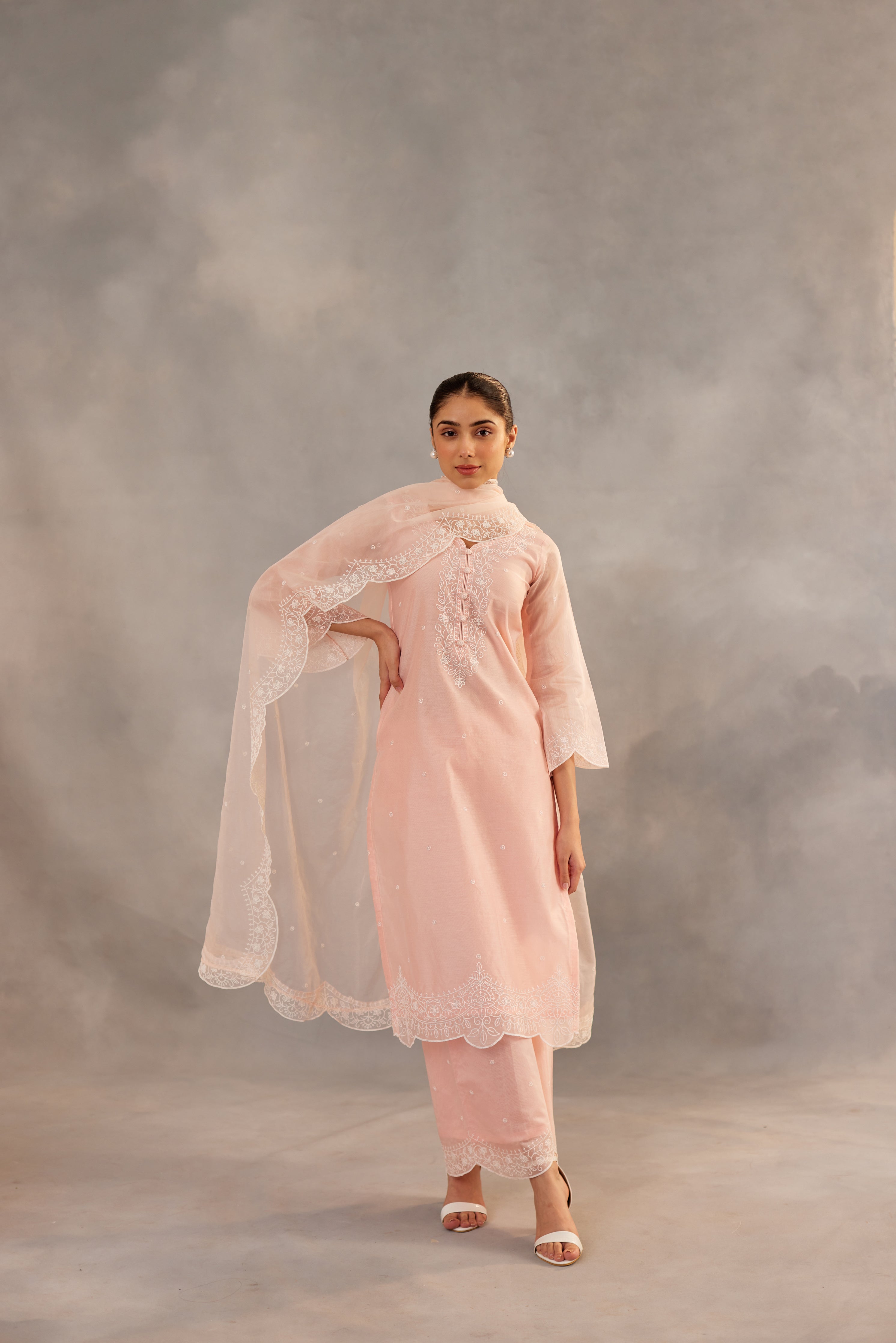 Diksha Juneja in Kamal - Peach Embroidered Suit Set.